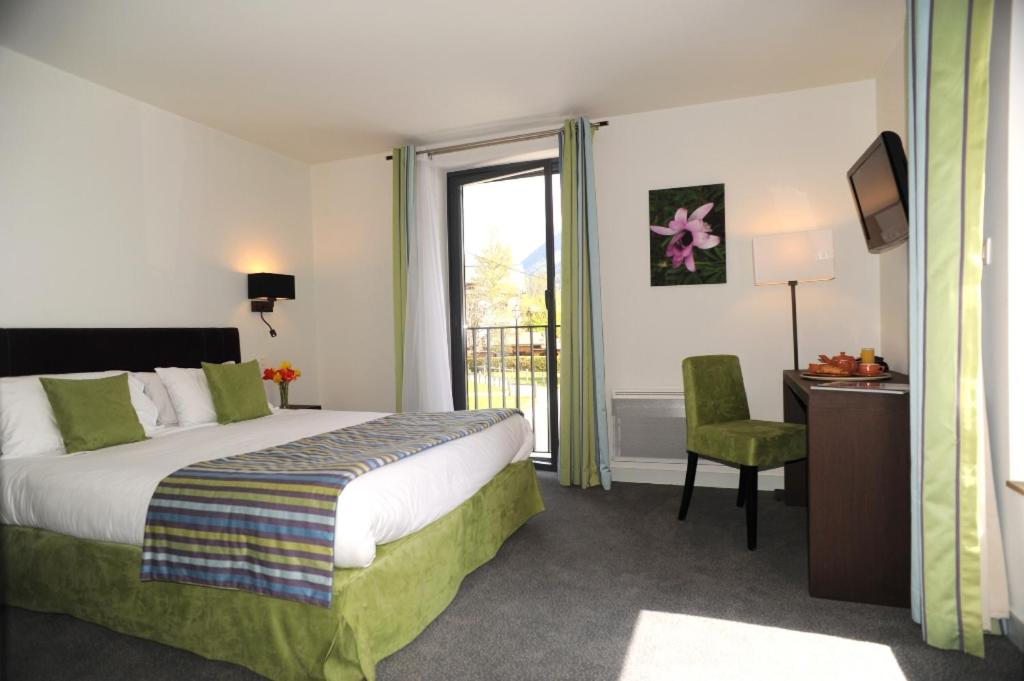 Postel nebo postele na pokoji v ubytování Hotel Les Lanchers