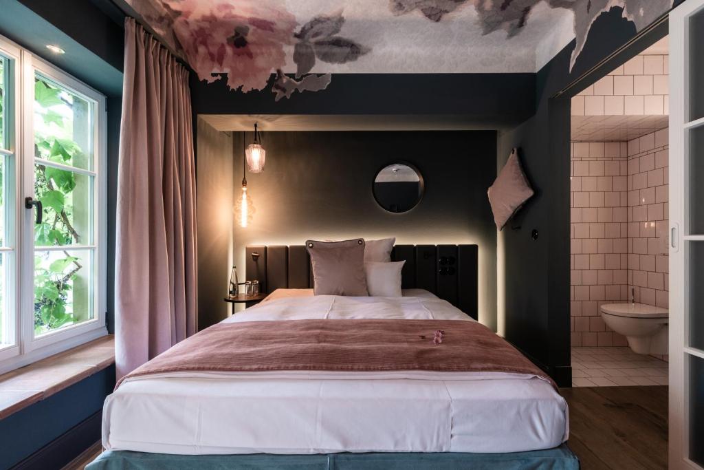 Postel nebo postele na pokoji v ubytování Hotel / Weingut Meintzinger