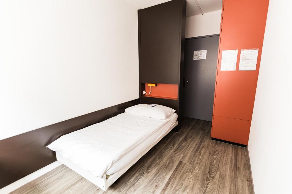 Postel nebo postele na pokoji v ubytování City Hostel Geneva
