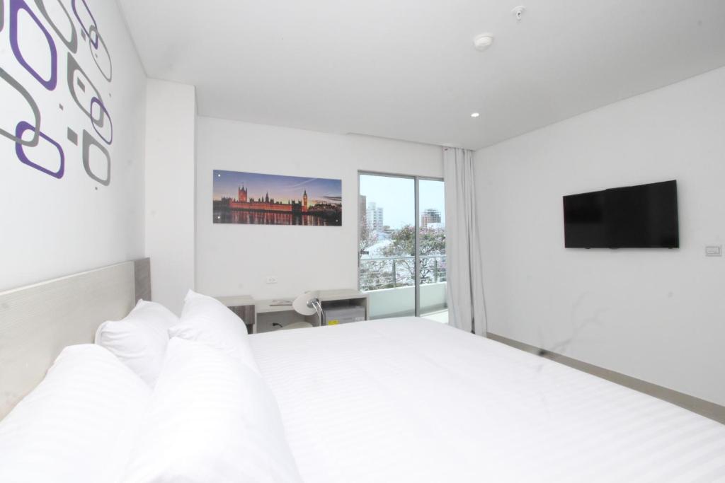 TV a/nebo společenská místnost v ubytování Hotel Oxford Barranquilla