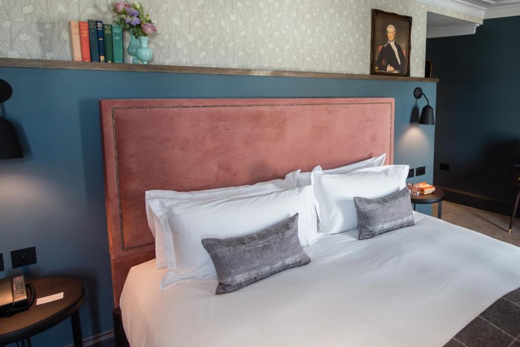 a bedroom with a white bed with two pillows at Avon Gorge by Hotel du Vin in Bristol