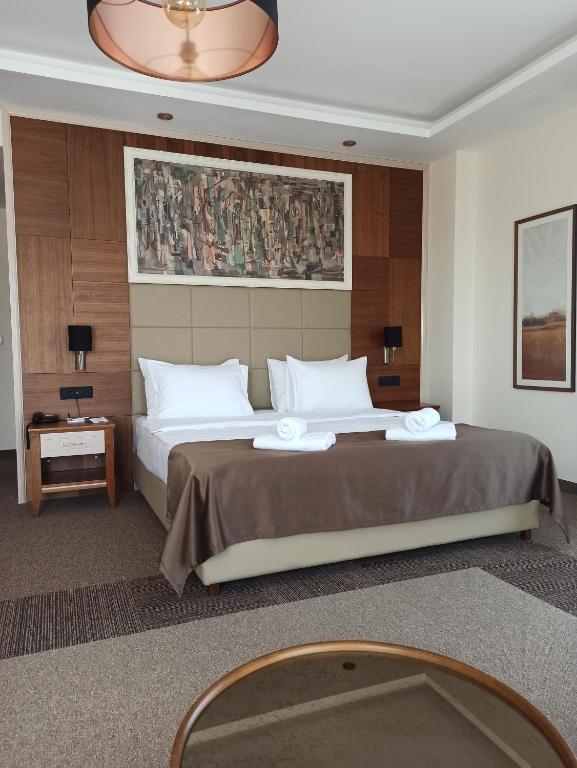 Llit o llits en una habitació de Hotel Lazaro