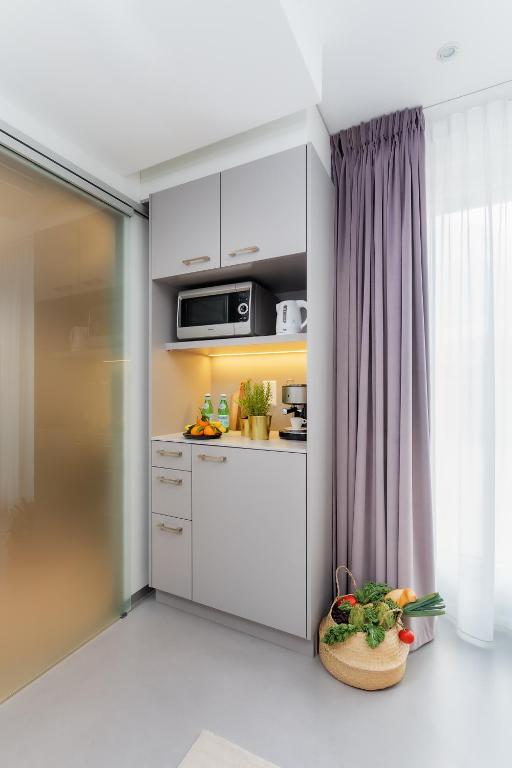 A cozinha ou kitchenette de VISIONAPARTMENTS Vevey - contactless check-in