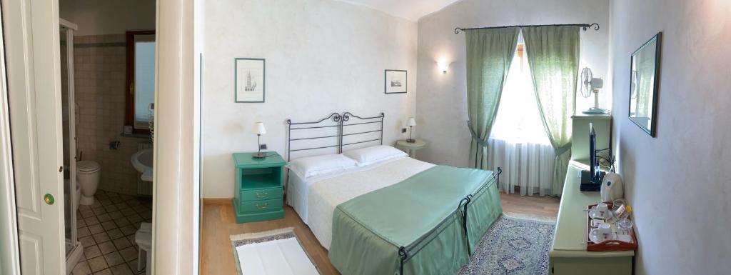 Postel nebo postele na pokoji v ubytování LA SISMONDA