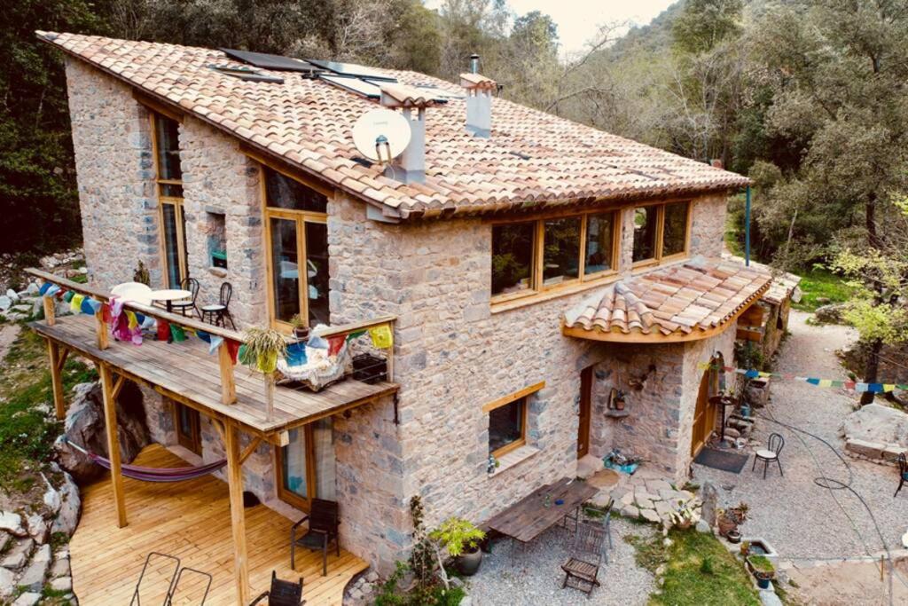 an aerial view of a stone house at Pont de Valenti Mountain Retreat in Girona