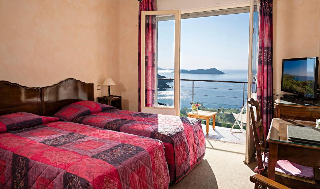 Cama o camas de una habitación en Hotel Provençal