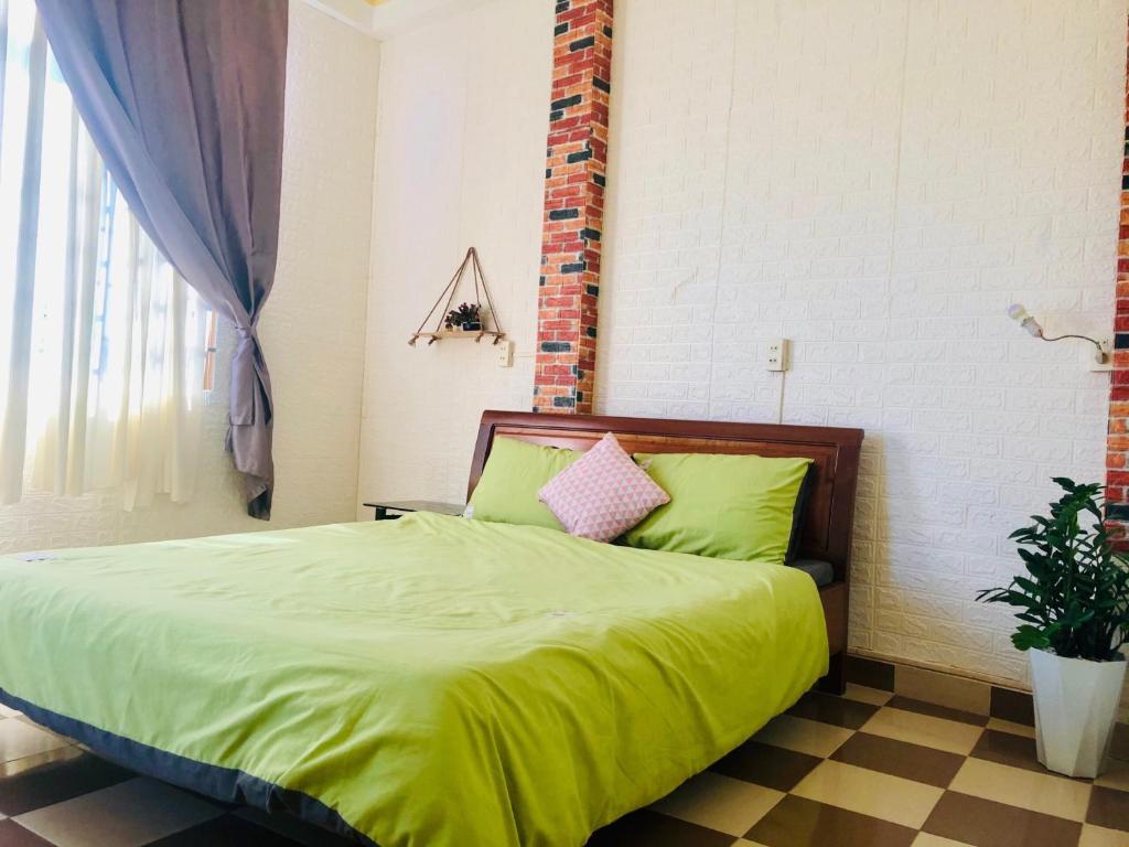 Postel nebo postele na pokoji v ubytování Nụ Cười Xinh