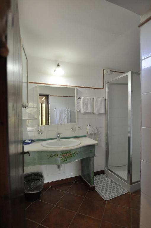 a bathroom with a sink and a shower at Villa Eva in Anacapri