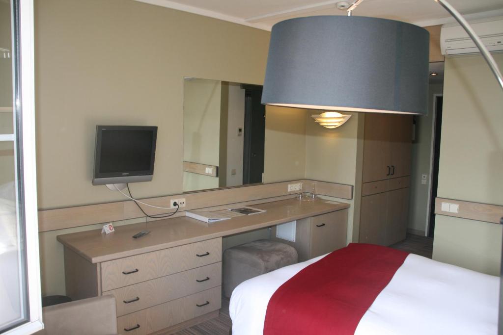 Voodi või voodid majutusasutuse Hotel Olivier toas