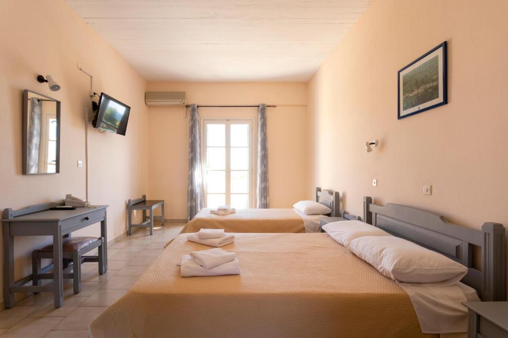 Postel nebo postele na pokoji v ubytování Vanas Apartments