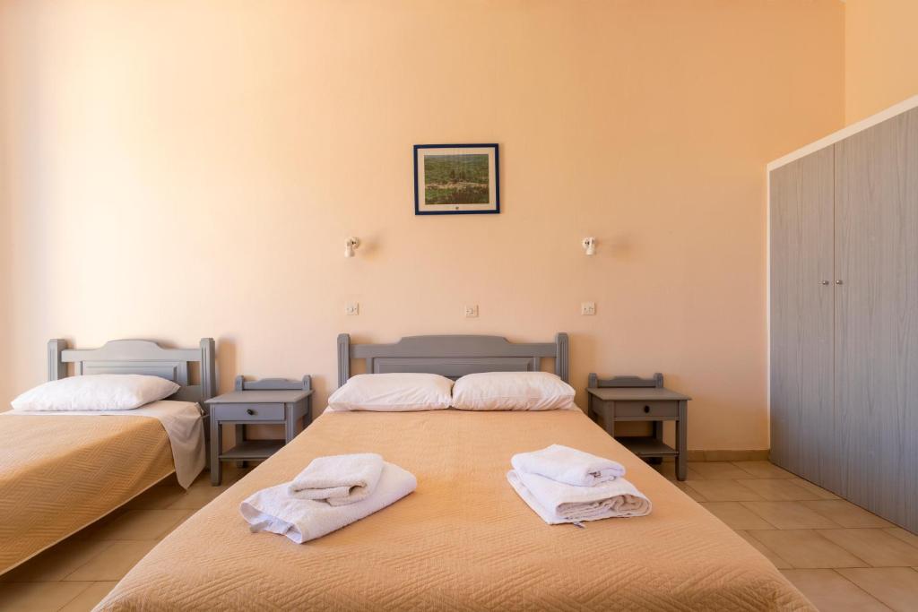 Postel nebo postele na pokoji v ubytování Vanas Apartments