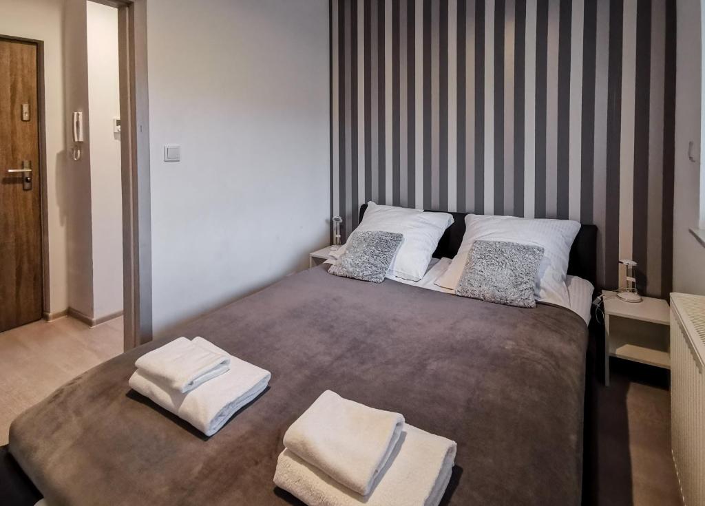 Postel nebo postele na pokoji v ubytování Apartament Kopydło