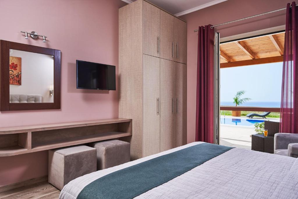 Postel nebo postele na pokoji v ubytování Saint Nicholas Villas