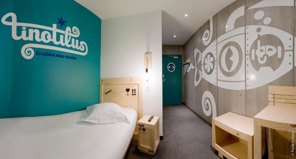 Postel nebo postele na pokoji v ubytování Hôtel Graffalgar