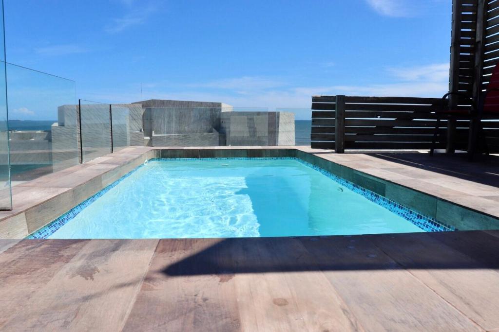 a swimming pool on top of a house at IL VICINO alojamientos BOCA del RÍO PLAYA in Boca del Río