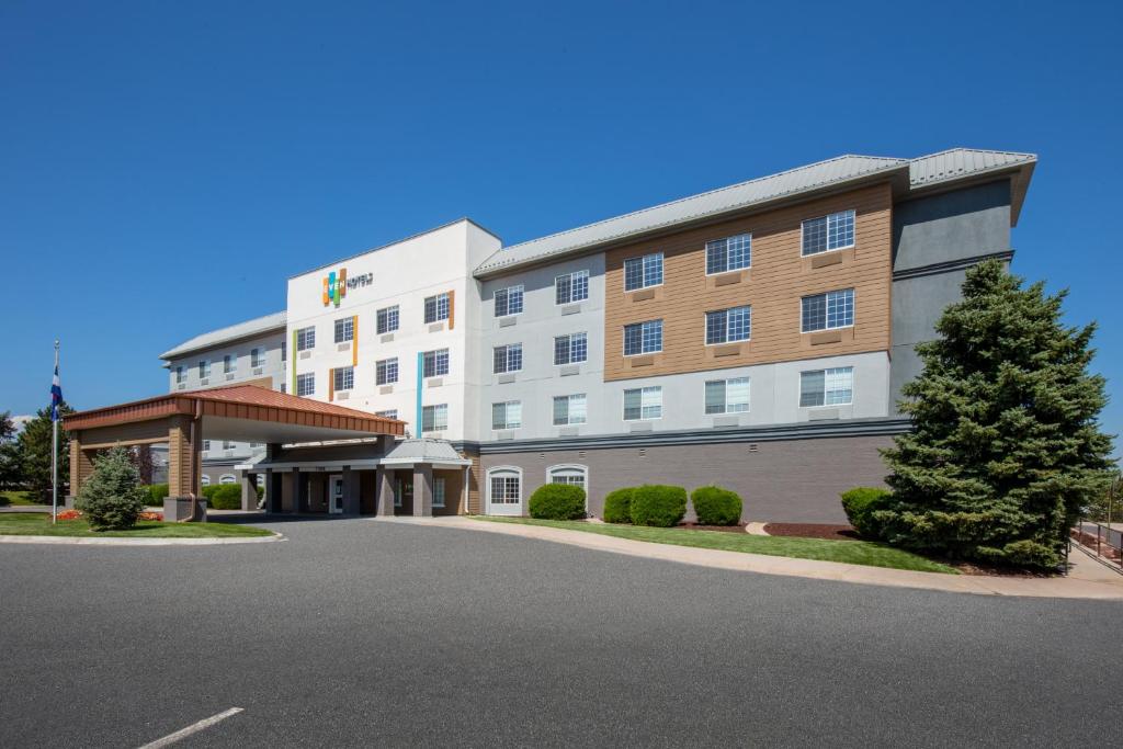 a hotel with a parking lot in front of it at EVEN Hotels Denver Tech Center-Englewood, an IHG Hotel in Centennial