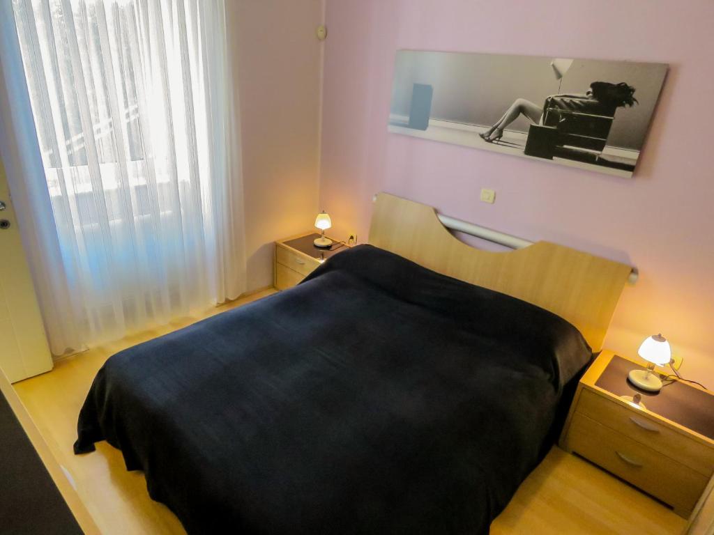 Postel nebo postele na pokoji v ubytování Apartment Palmic Lovran