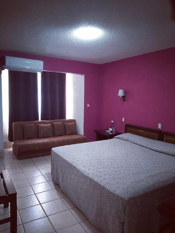 Postel nebo postele na pokoji v ubytování Hotel Aurora