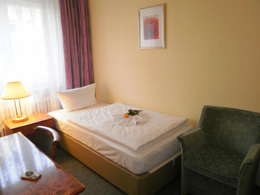 Postel nebo postele na pokoji v ubytování Hotel Amadeus Central