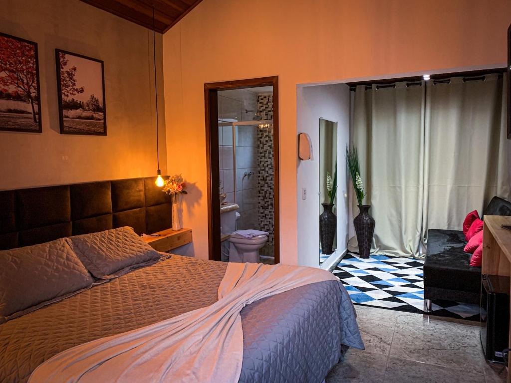 Giường trong phòng chung tại Recanto Bella Fonte