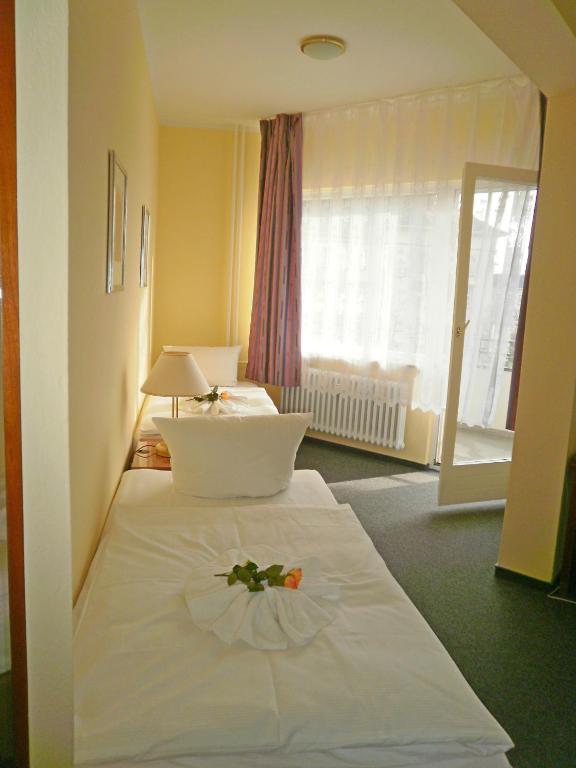 Postel nebo postele na pokoji v ubytování Hotel Amadeus Central