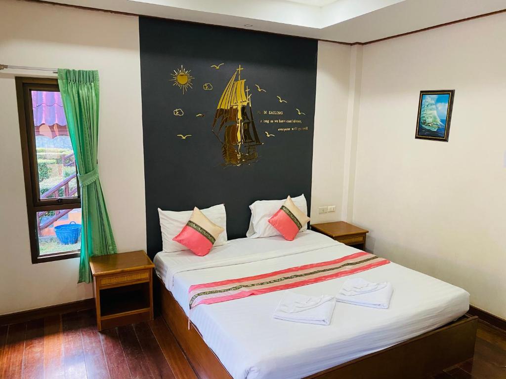 Postel nebo postele na pokoji v ubytování Kaibae Hut Resort