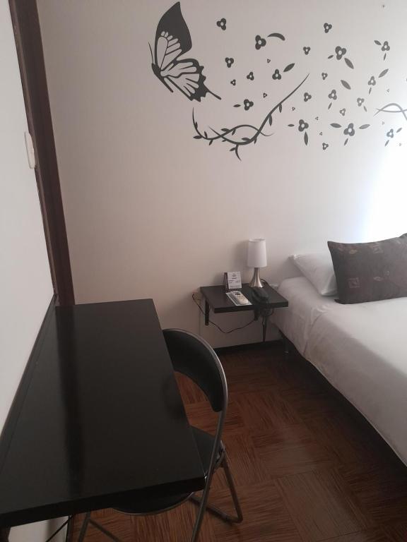 Postel nebo postele na pokoji v ubytování Hotel Confort Bogota