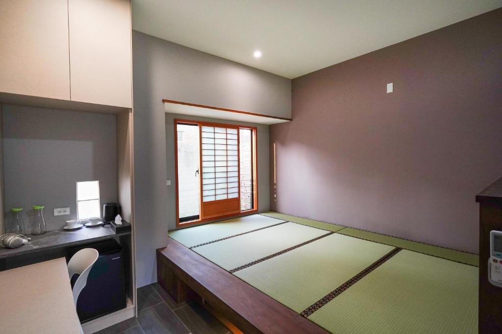 Letto o letti in una camera di Nenggao Club B&B