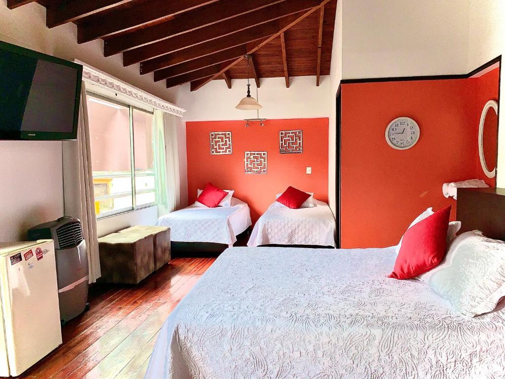 Postel nebo postele na pokoji v ubytování Hotel Lleras Premium #1