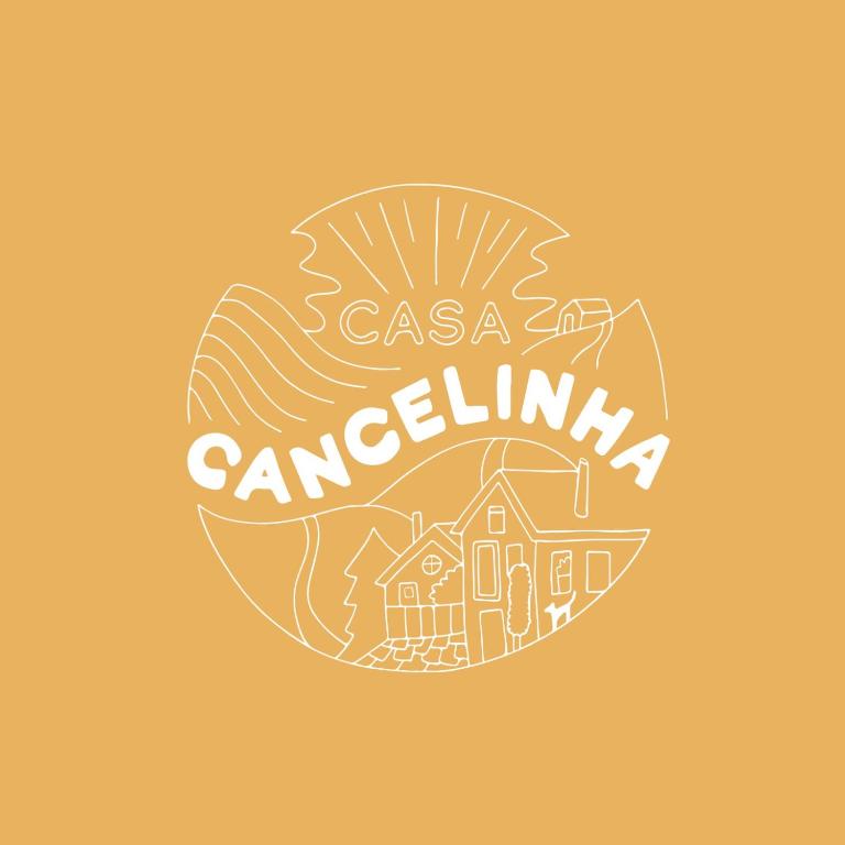 a logo for a travel agency with a house and the words casa carolina at Mountainhome Casa Cancelinha in Soito