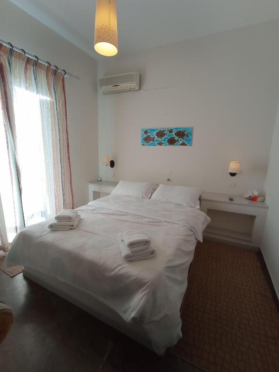 Łóżko lub łóżka w pokoju w obiekcie Zoe Pension