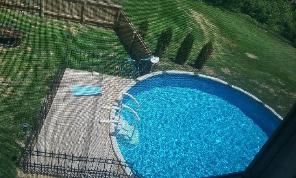an overhead view of a large blue swimming pool at Boothie Manor in Davenport