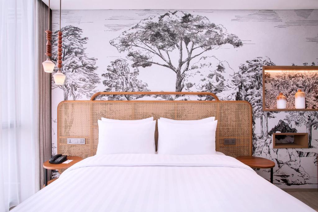 Letto o letti in una camera di Mercure Tangerang BSD City