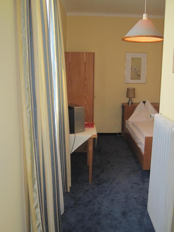 Postel nebo postele na pokoji v ubytování Hotel Drei Hasen