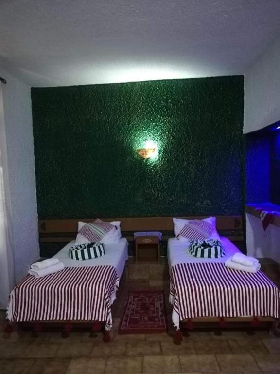 Una cama o camas en una habitación de HOTEL REGINA