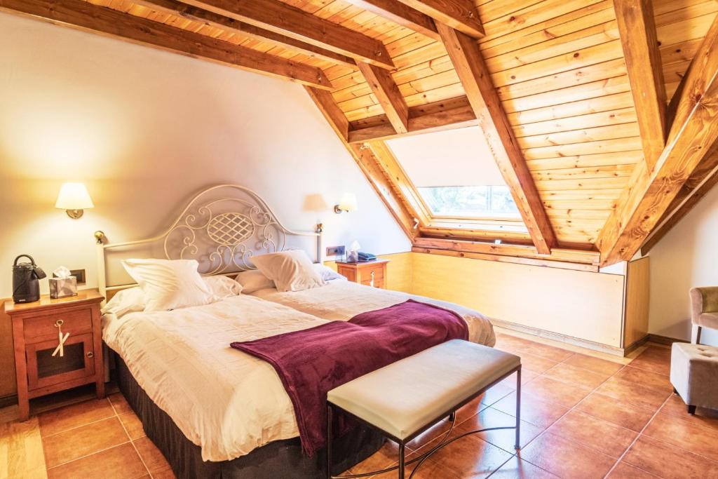 Postel nebo postele na pokoji v ubytování Mauberme Mountain Boutique Hotel