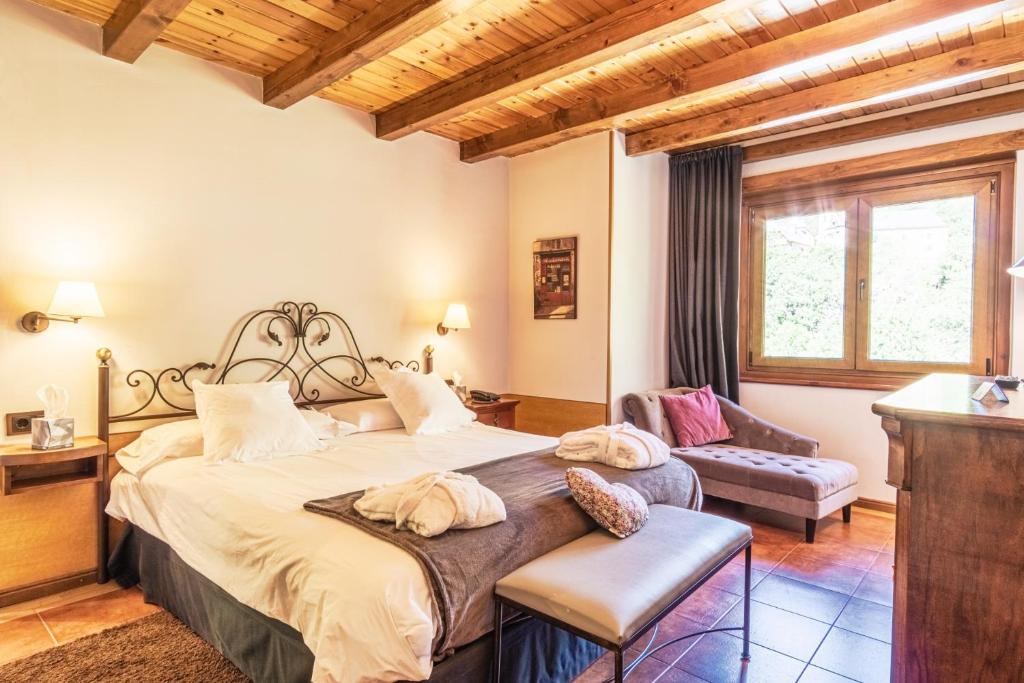 Postel nebo postele na pokoji v ubytování Mauberme Mountain Boutique Hotel
