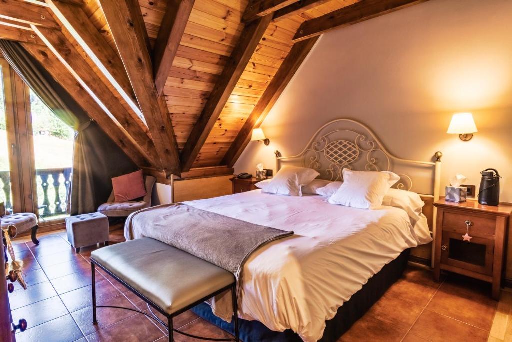 Postel nebo postele na pokoji v ubytování Mauberme Mountain Boutique Hotel