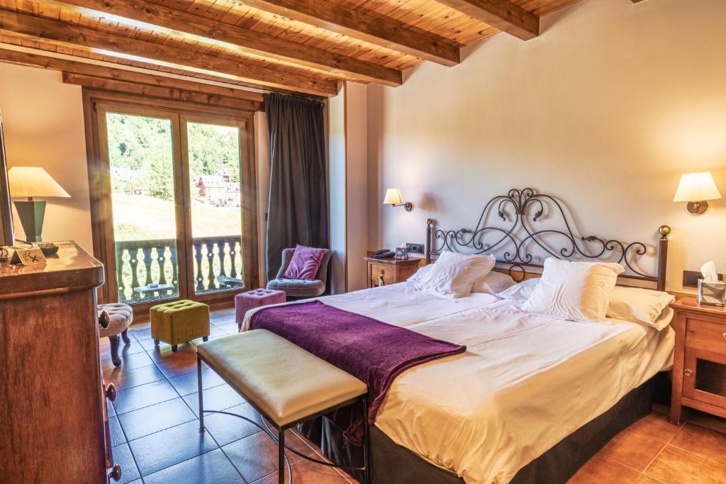 Postel nebo postele na pokoji v ubytování Mauberme Mountain Boutique Hotel