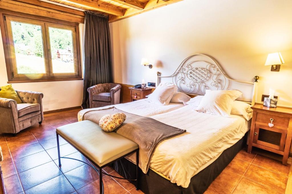 Postel nebo postele na pokoji v ubytování Mauberme Mountain Boutique Hotel