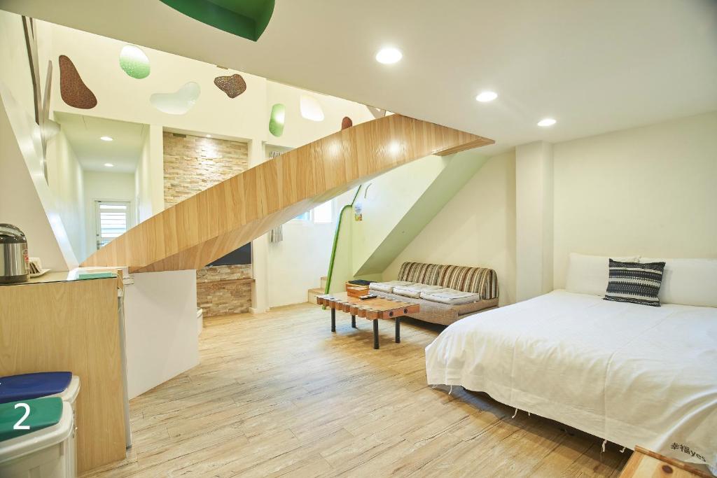 Postel nebo postele na pokoji v ubytování Happiness Yes Inn