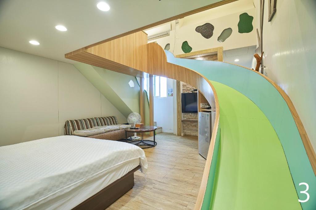 Postel nebo postele na pokoji v ubytování Happiness Yes Inn