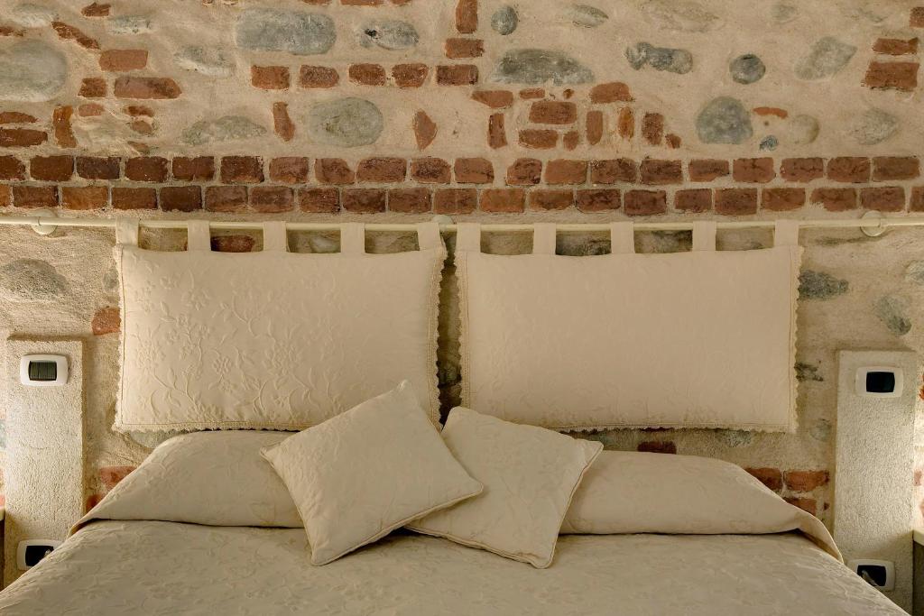 Posteľ alebo postele v izbe v ubytovaní Hotel Cascina Di Corte