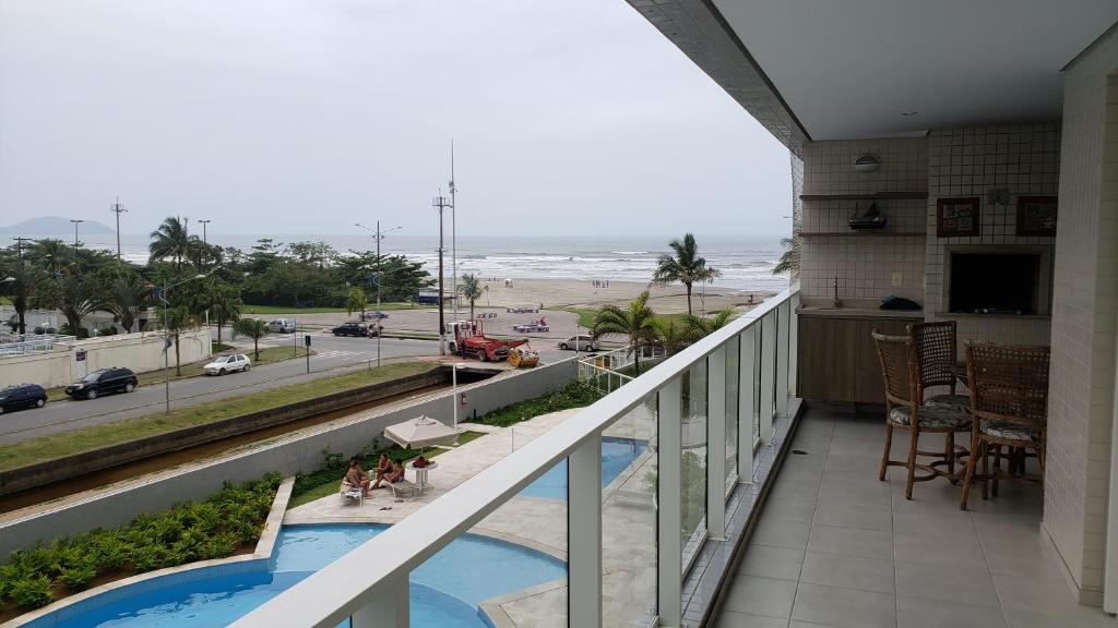 a balcony with a view of the beach at Boulevard Family Club in Bertioga