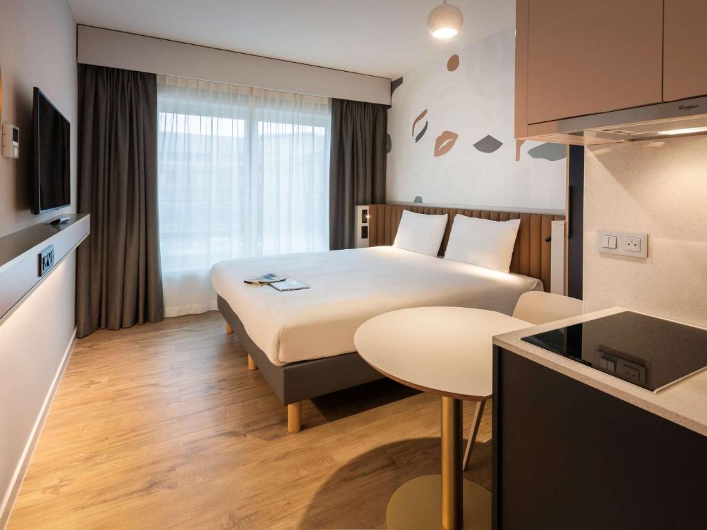 Postel nebo postele na pokoji v ubytování Adagio access Brussels Delta