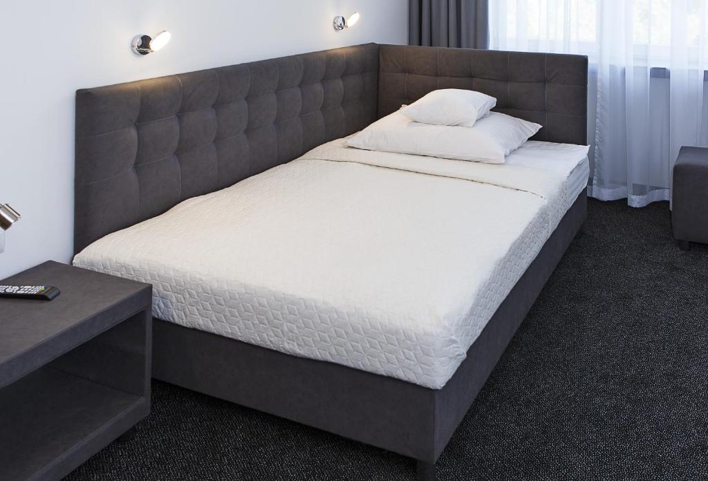 Postel nebo postele na pokoji v ubytování InterHotel