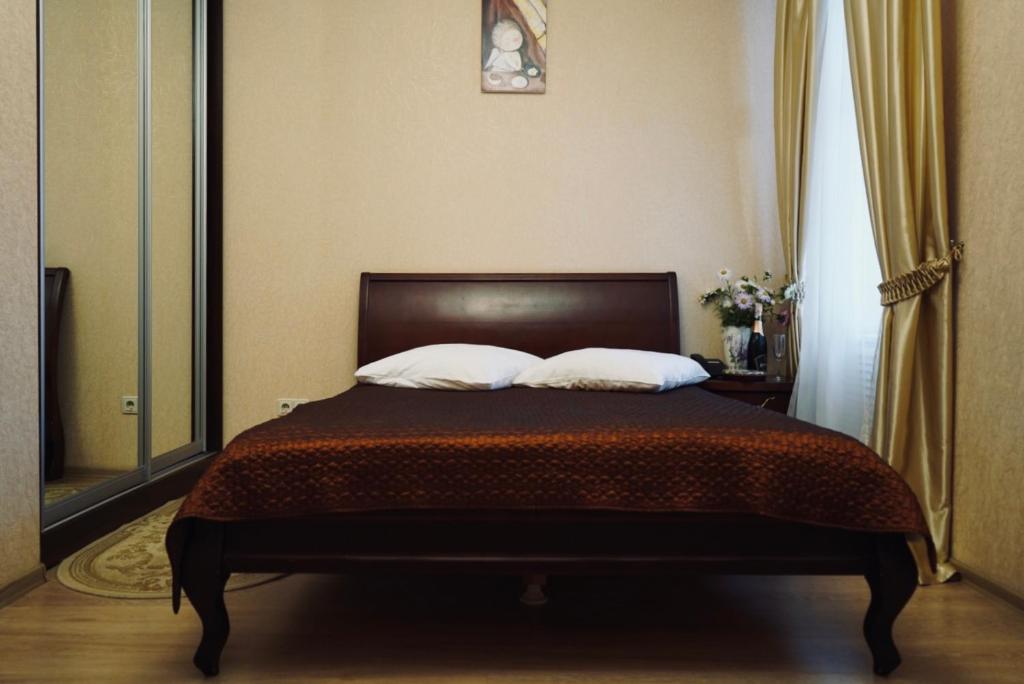 Postel nebo postele na pokoji v ubytování Evropeyskiy