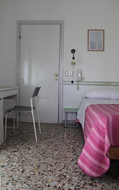 Postel nebo postele na pokoji v ubytování Albergo Moderno
