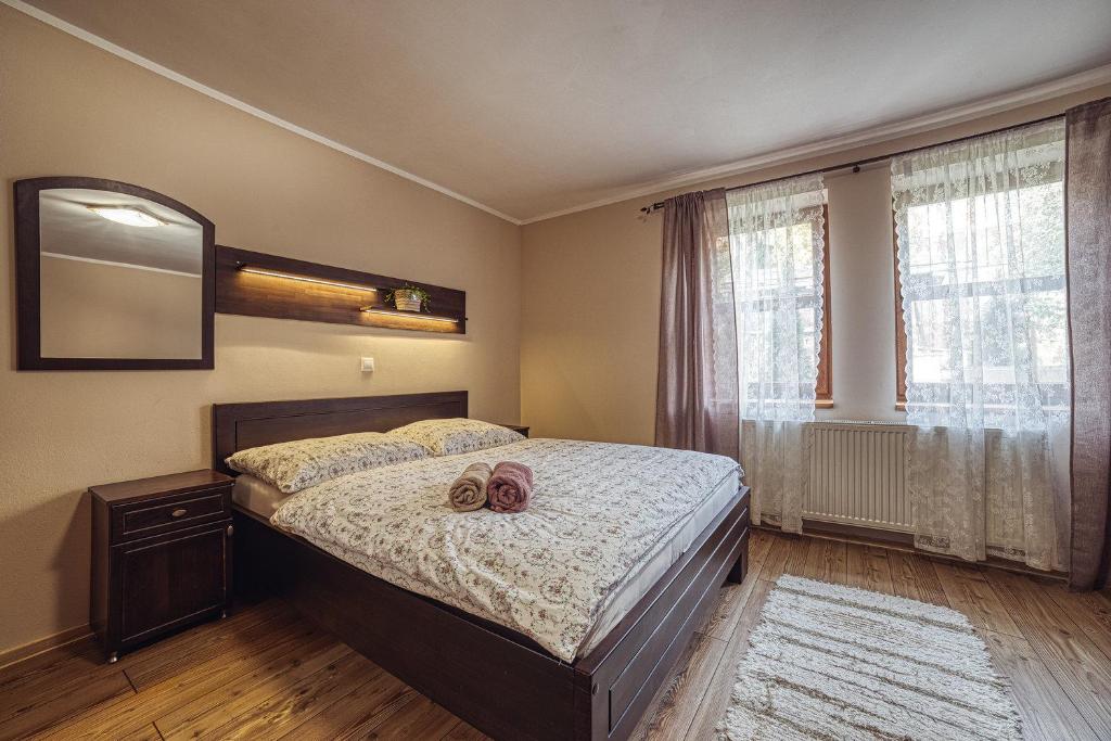 Postel nebo postele na pokoji v ubytování ZET - Penzion & Wellness