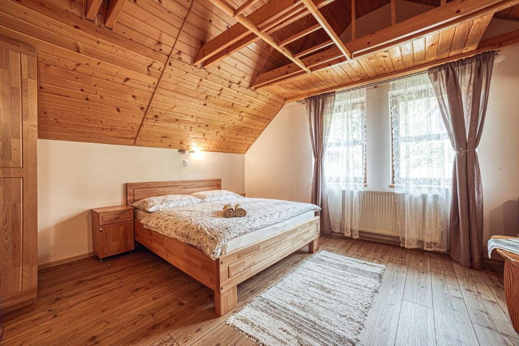 Postel nebo postele na pokoji v ubytování ZET - Penzion & Wellness